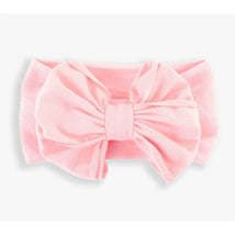 Pink headband featuring a large, textured bow, designed for young girls by Rufflebutts.
