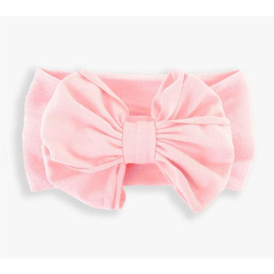 Pink headband featuring a large, textured bow, designed for young girls by Rufflebutts.