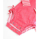 Hot pink heart-patterned long sleeve one-piece rash guard for infants, featuring snaps and ruffled edges.