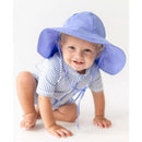 Periwinkle blue seersucker short sleeve one-piece rash guard on a smiling toddler wearing a matching sun hat.