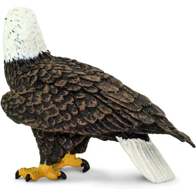Bald Eagle figurine with detailed feathers, sharp yellow beak, and talons, designed for educational and decorative purposes.