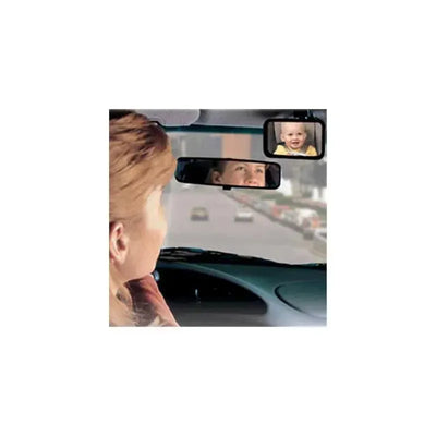 A woman driving looks into a rearview mirror that displays a baby in a rear view mirror, ensuring safe travel.