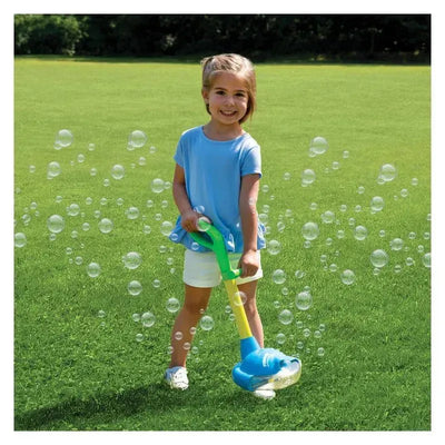 Young girl in a blue shirt using a Sandy Ruben no-spill motorized bubble weed wacker on grass, bubbles surrounding her.
