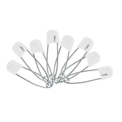 Eight white diaper pins with silver metal clasps arranged in a circular pattern, designed for securing cloth diapers.