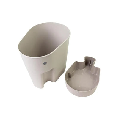 Taupe Shnuggle bath toy storage scoop, featuring a main container and a smaller scoop with a playful design.