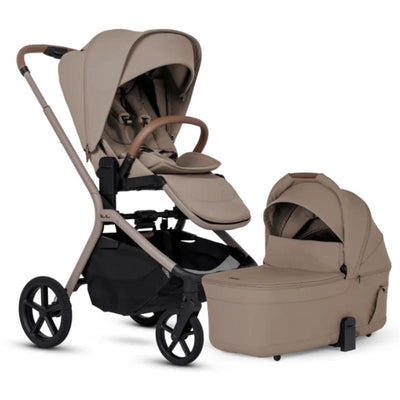 Silver Cross Breez Compact Stroller in Champagne color with a matching folding bassinet, featuring a sleek design and tan fabric.