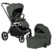 Silver Cross Breez Compact Stroller in pewter with a matching folding bassinet, featuring a modern design and grey fabric.