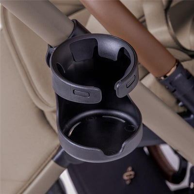 Black cup holder designed for the Silver Cross Breez stroller, mounted on the stroller frame.