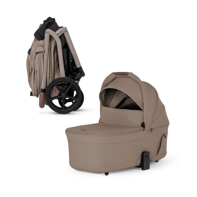 Champagne-colored Silver Cross Breez bassinet, folding design with integrated wheels and a collapsible canopy.