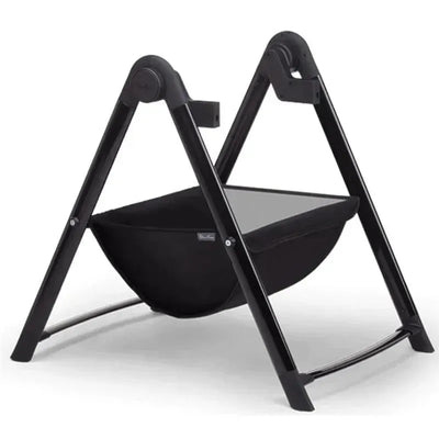 Black Silver Cross Coast/Wave Bassinet Stand featuring a sleek frame and a soft bassinet for newborns.