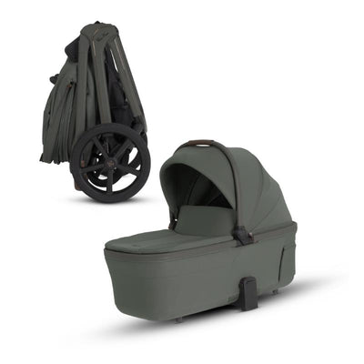 Silver Cross Cove 2 Compact Bassinet in pewter color, showcasing a folding design and plush interior for infants.
