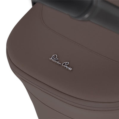 Chocolate-colored fabric of the Silver Cross Nia Compact Folding Bassinet with a silver logo.