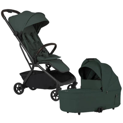 Silver Cross Nia Compact Travel Stroller and Bassinet Bundle in Conifer, featuring a dark green fabric and a sleek design.
