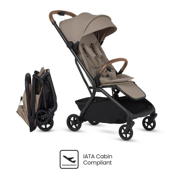 Compact travel stroller in Champagne color, featuring a foldable design and IATA Cabin Compliant logo.