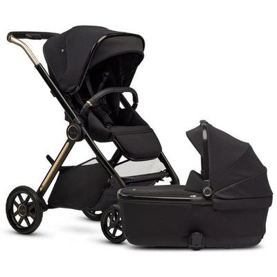 Silver Cross Reef 2 multi-terrain stroller and bassinet bundle in espresso, featuring a sleek design with a black fabric seat and canopy.