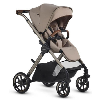 Silver Cross Reef 2 Multi-terrain Modular Stroller in Frappe color with brown leatherette handles and a spacious under-seat storage basket.