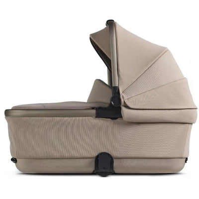 Silver Cross Reef First Bed Folding Bassinet in Frappe color, featuring a sleek design with a canopy and padded sides.