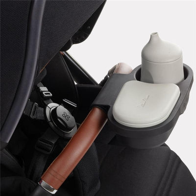 Universal Snack Tray for Silver Cross stroller, featuring a gray container and lid, with a cup holder attachment.