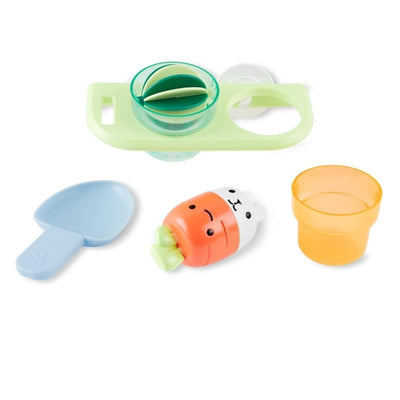 Skip Hop Baby Bath Toy set featuring a green tray, a blue scoop, an orange cup, and a bunny-shaped water toy.