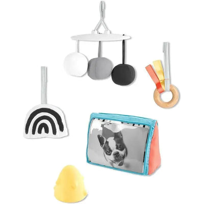 Montessori-inspired baby play gym featuring soft hanging toys, a rainbow design, a photo frame, and a rubber chick.