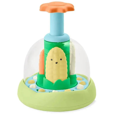Colorful Skip Hop Farmstand Push and Spin Baby Learning Toy with stacking corn pieces under a clear dome.