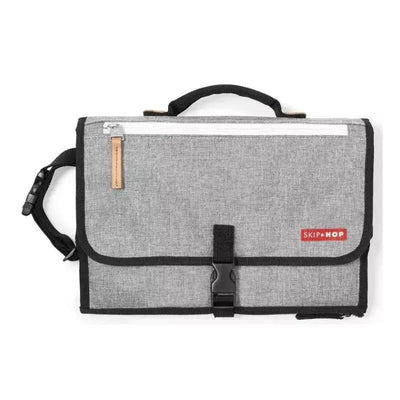 Portable Baby Changing Pad by Skip Hop in Grey Melange, featuring a top handle, zipper pocket, and black trim.