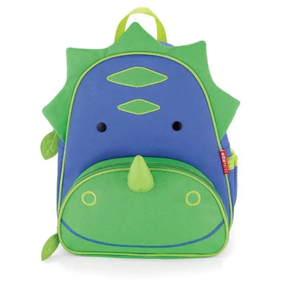 Dinosaur-themed Skip Hop Zoo Little Kid Backpack in blue and green, featuring a friendly face and spikes.