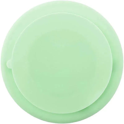 Green silicone suction plate for babies with a dino design, featuring a round shape and secure suction base.