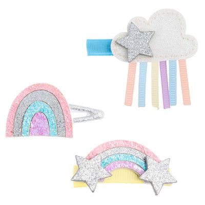 Glittery hair clips featuring rainbow and cloud designs, with pastel colors and star embellishments.
