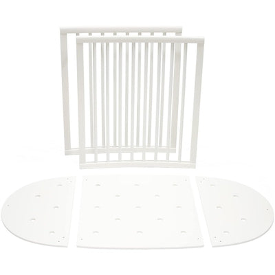 Stokke Sleepi™ Bed Extension in white, featuring two slatted side panels and two rounded end panels for bed size extension.