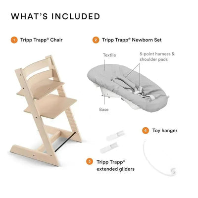 Tripp Trapp® Natural W Newborn set includes a natural wooden chair, newborn seat with harness, extended gliders, and a toy hanger.