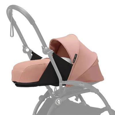 Stokke Yoyo 0+ Newborn Pack in Ginger, featuring a pink fabric canopy and a black base, designed for newborns.