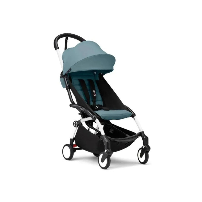 Stokke Yoyo³ stroller with a white frame and aqua seat, featuring a sunshade and a spacious under-seat storage.