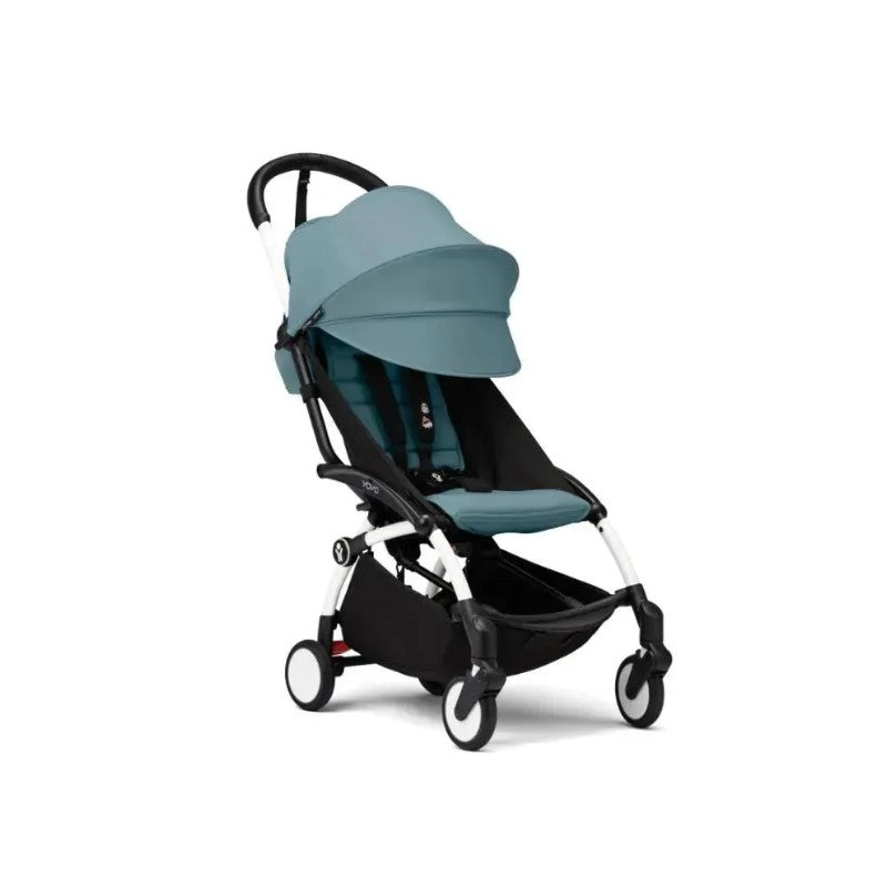Stokke Yoyo³ stroller with a white frame and aqua seat, featuring a large canopy and a storage basket.