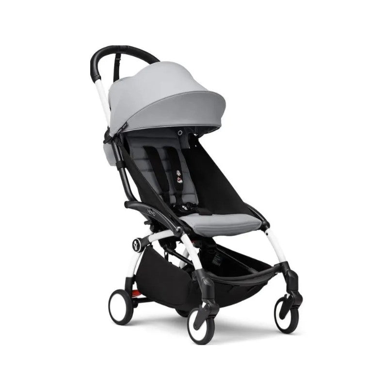 Stokke Yoyo³ stroller in White Frame/Stone with adjustable leg rest, featuring a sleek design and comfortable seat.