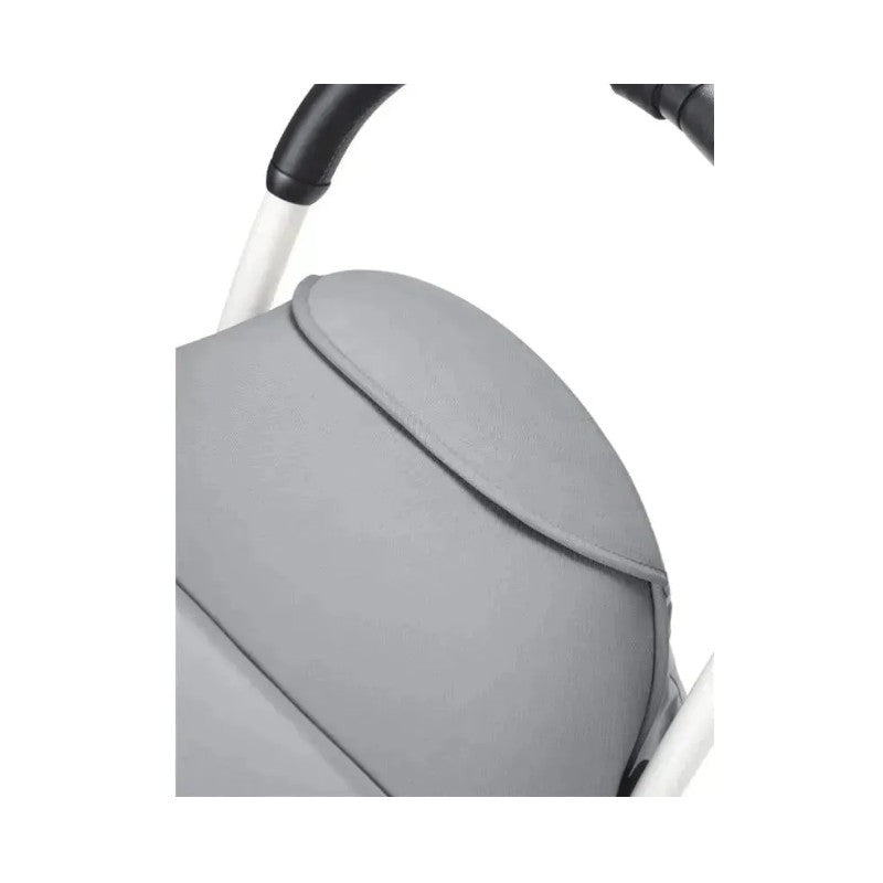 Stokke Yoyo³ stroller leg rest in light gray, showcasing the fabric texture and white frame.