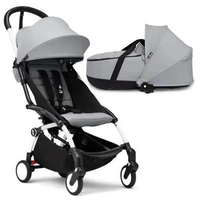 Stokke Yoyo³ stroller bundle in black and white with a stone color pack and stone bassinet.