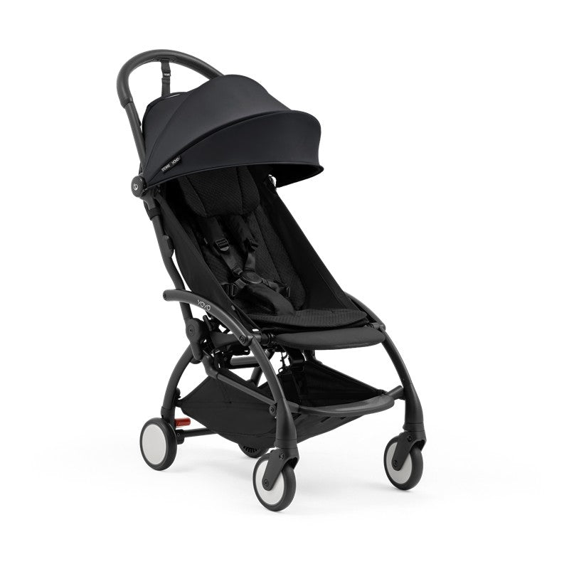Stokke Yoyo5 compact stroller featuring a black frame and fabric, designed for easy navigation and portability.
