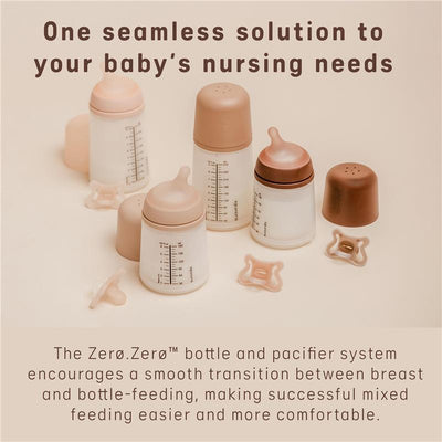 Suavinex Zero Zero Newborn Starter Set featuring two anti-colic baby bottles and a pacifier, designed for easy mixed feeding.