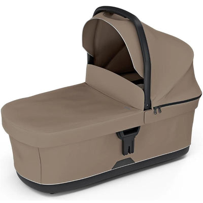 Thule Urban Glide 3 Bassinet in Tinted Taupe, featuring a sleek design with a protective canopy and zippered storage.