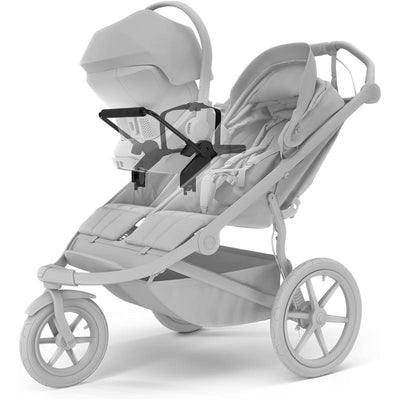 Thule Urban Glide 3 Double Car Seat Adapter in universal black attached to a stroller with a visible infant car seat.