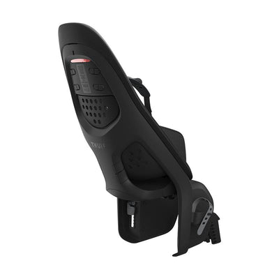 Thule Yepp 2 rear frame mount child bike seat in black, featuring safety straps and ventilation holes for comfort.