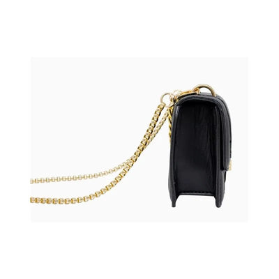 Classic black quilted handbag with a large flap and gold chain strap, showcasing its side view and sleek design.