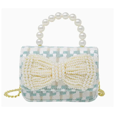 Tweed purse with a blue and white woven pattern, featuring a large pearl bow and a pearl handle.