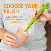 Boon CACTI Replacement Brush Set in green, showcasing a hand holding multiple brushes, with text detailing included brushes.