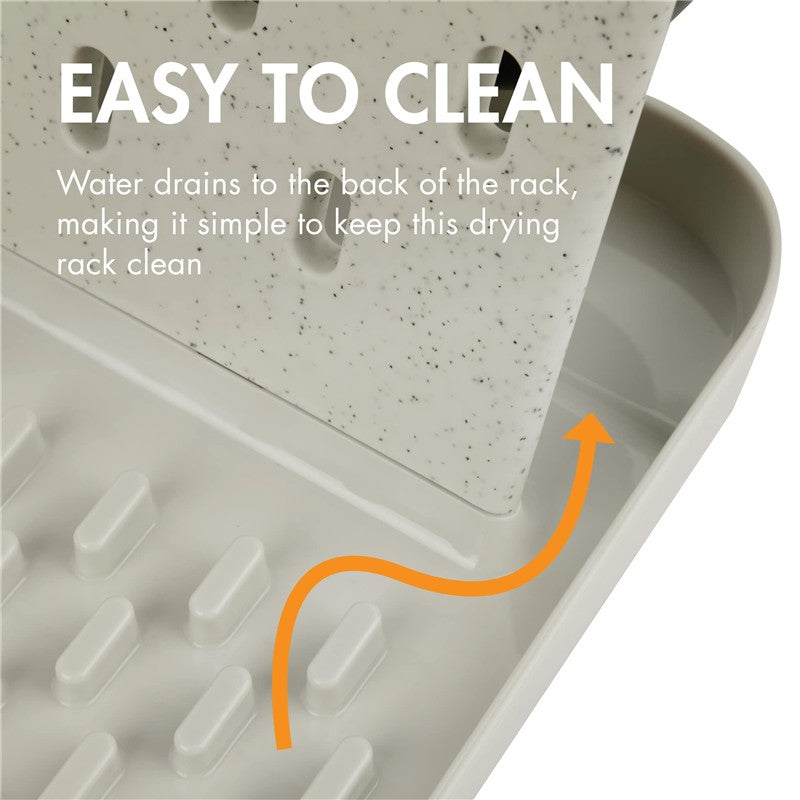 Customizable vertical drying rack with a speckled surface and a drainage system for easy cleaning.
