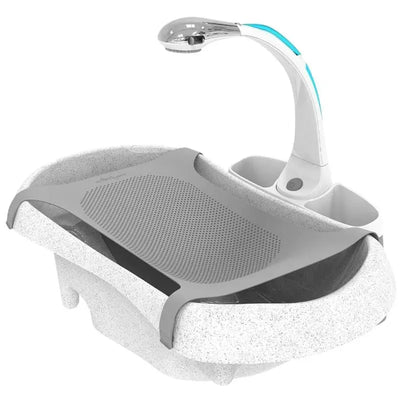 Tomy Rain Shower Spa Bath featuring a textured gray mat, a sleek faucet with an illuminated handle, and storage areas.
