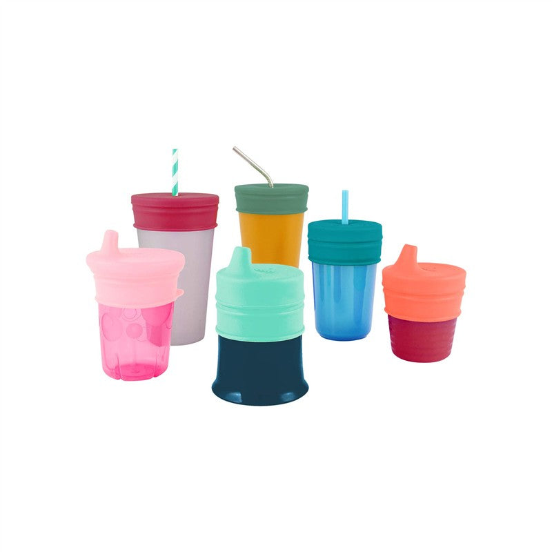 Boon SNUG Spout Universal Silicone Sippy Lids in green, designed to fit various cups, shown with colorful cups around them.