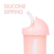 Boon SWIG Silicone Straw Cup in pink, 9 oz, featuring a transparent measuring scale and a flexible silicone straw.