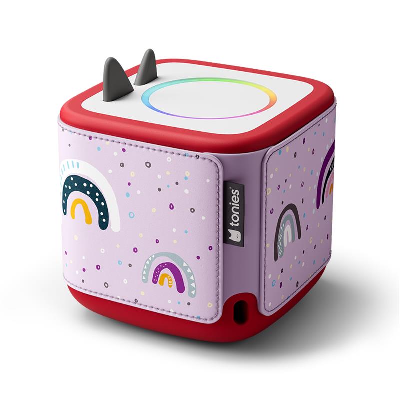 Decorative wrap for Toniebox 2 featuring a playful rainbow design on a purple background with multicolored dots.